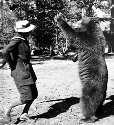 Enid Michael, overdressed for her dance with a bear.